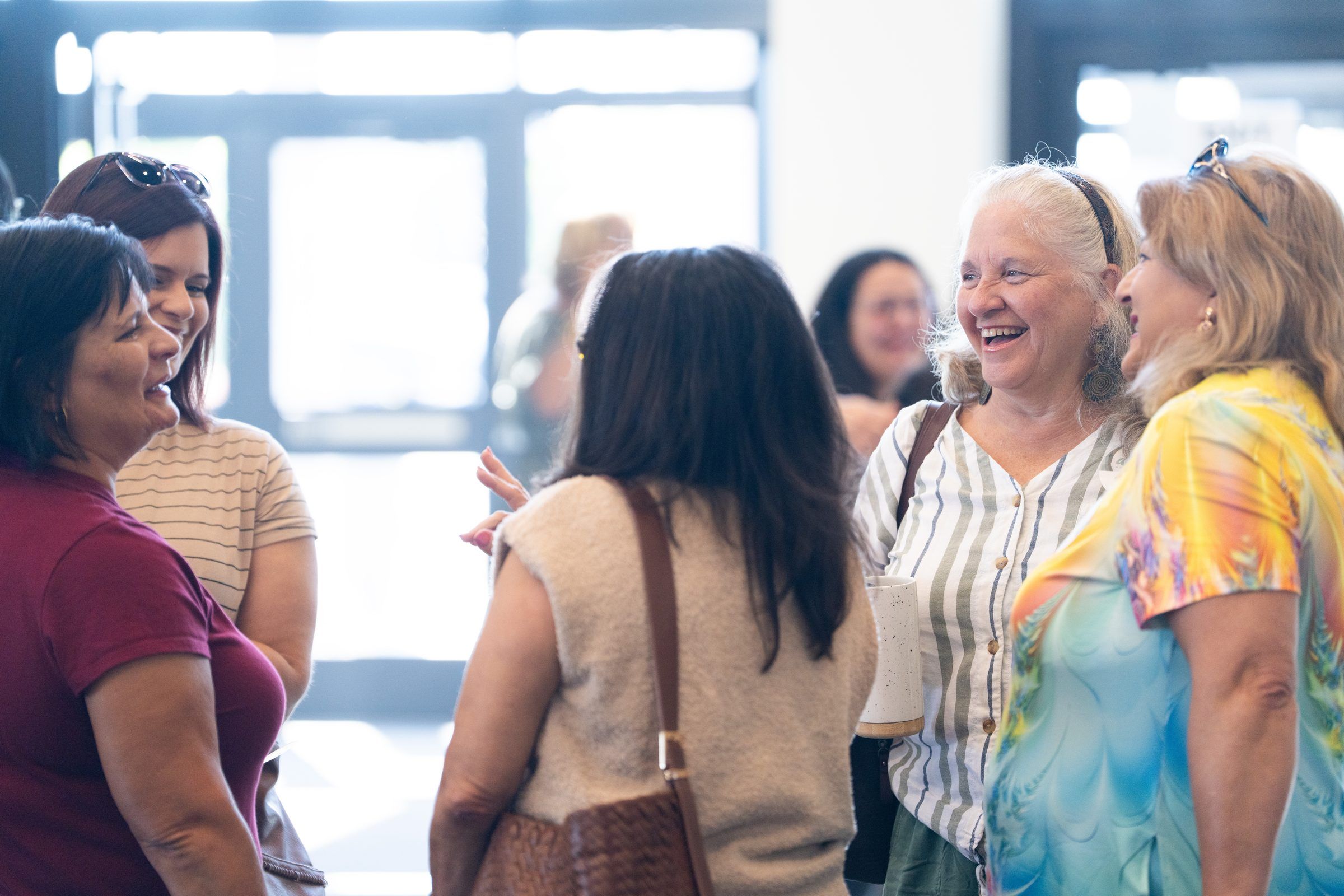 Women Laughing Together in the Lobby