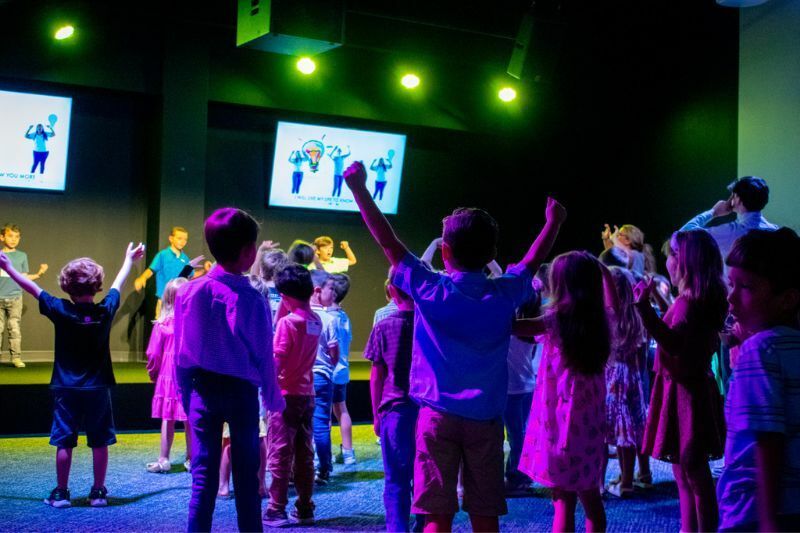 Kids worshiping in the Kids Ministry room