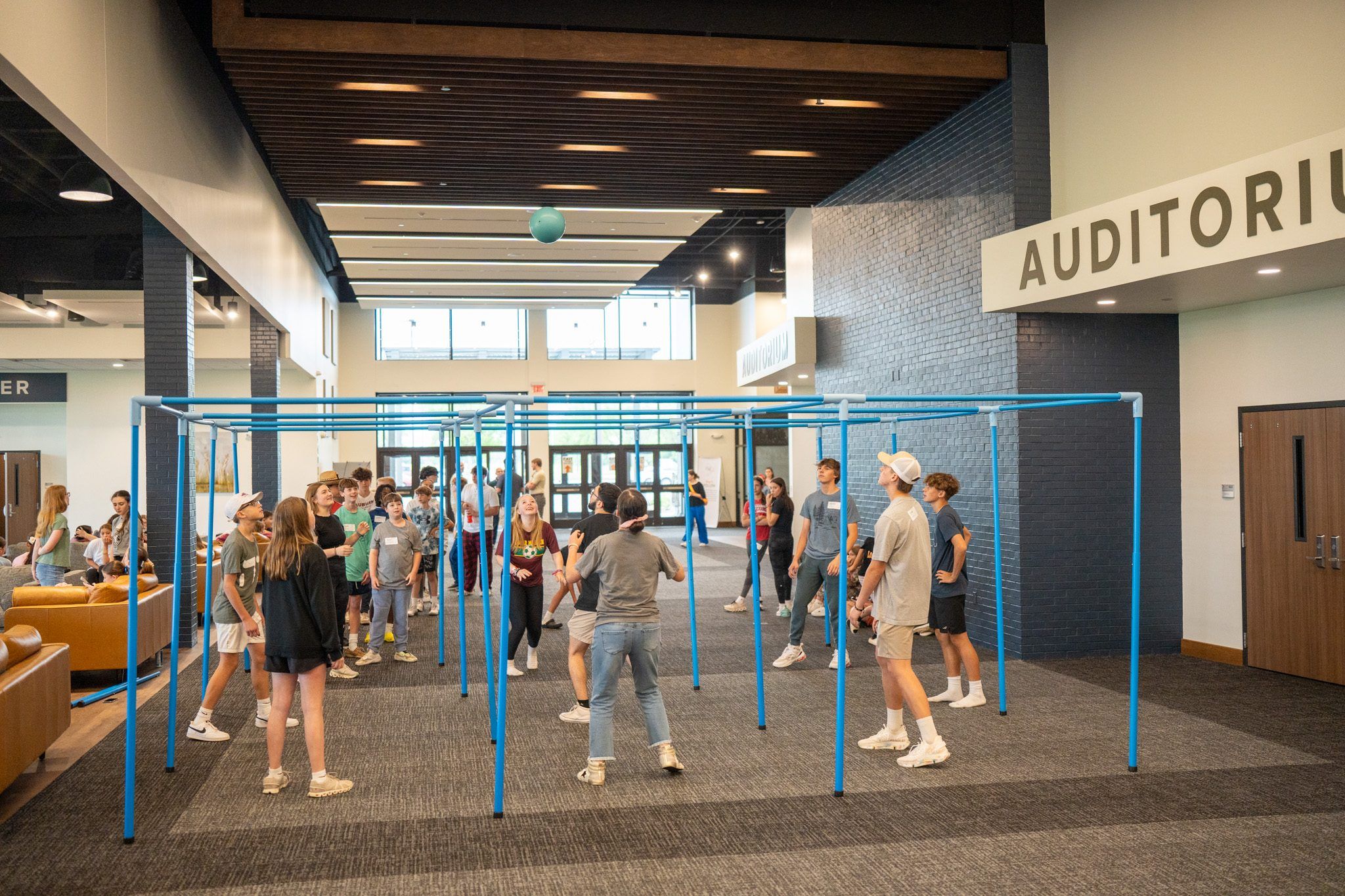 Students playing a group game in the lobby